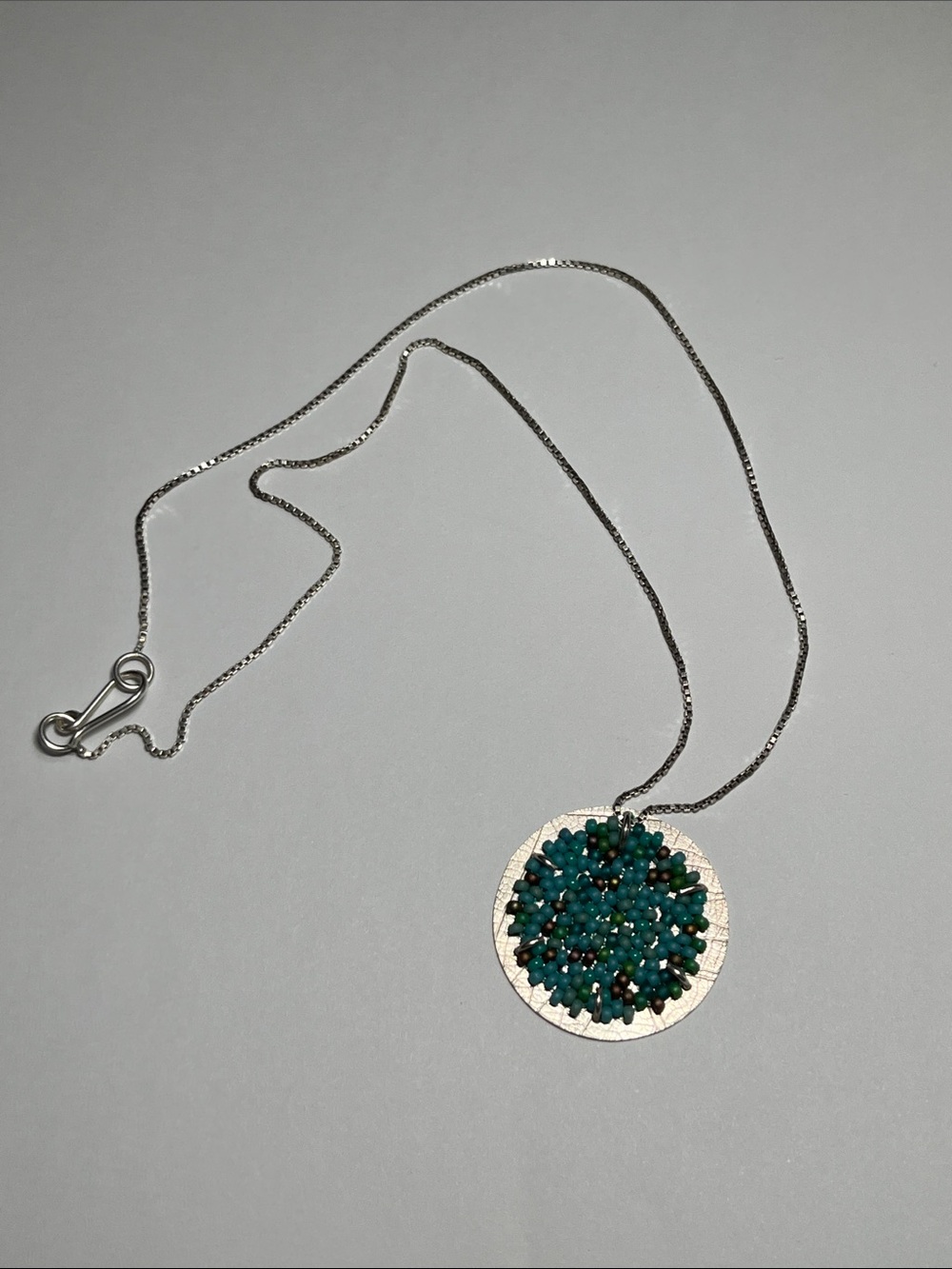 Silver Necklace with Teal Bead Cluster Medallion